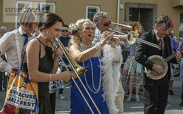 Jazz musicians  The Carling family  play on the street in Ystad in the opening of the Ystad Jazz Festival 2024  Skåne County  Sweden  Scandinavia  Europe