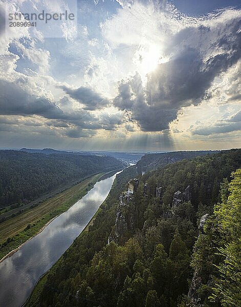 The Bastei is a rock formation with a viewing platform in Saxon Switzerland on the right bank of the River Elbe in the municipality of Lohmen between the spa town of Rathen and the town of Wehlen. It is one of the most visited tourist attractions in Saxon Switzerland. Dramatic sky over the Bastei  Saxon Switzerland  Rathen  Saxony  Germany  Europe