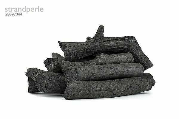 Natural wood charcoal isolated on white background. Pile of coal isolated on white background