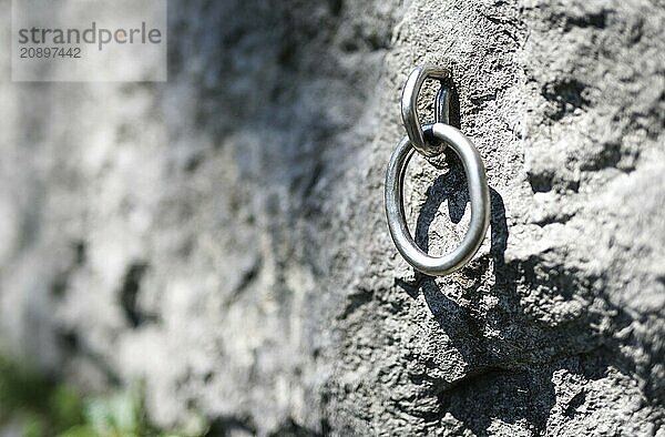 A hook used for sport climbing hangs in a rock face in Morsbach  09.07.2024