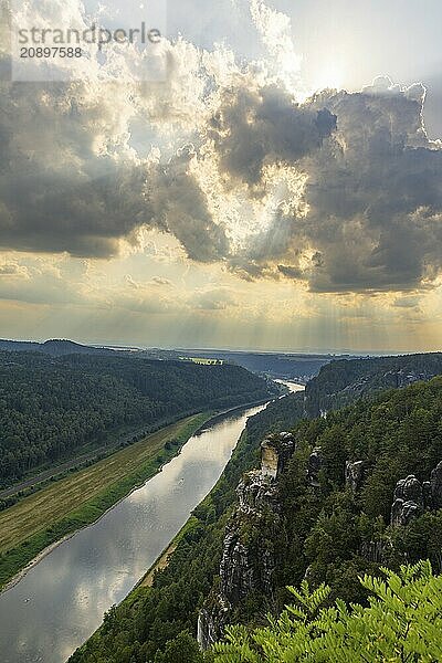 The Bastei is a rock formation with a viewing platform in Saxon Switzerland on the right bank of the River Elbe in the municipality of Lohmen between the spa town of Rathen and the town of Wehlen. It is one of the most visited tourist attractions in Saxon Switzerland. Dramatic sky over the Bastei  Saxon Switzerland  Rathen  Saxony  Germany  Europe