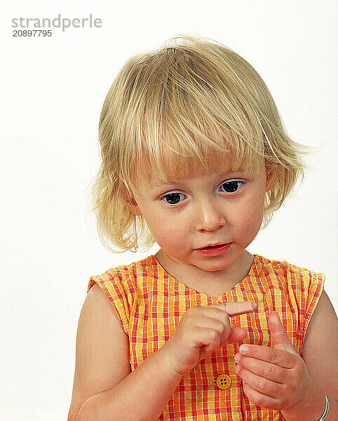 Children. Close up of little girl with medical plaster on her finger.