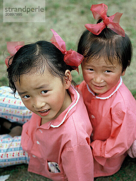 China. Shanghai. Local children. Little girls outdoors.