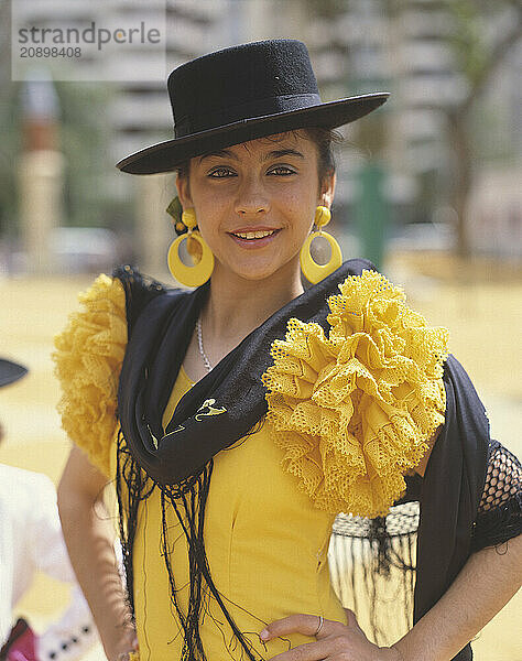 Spain. Andalusia region. Cádiz. The Jerez Horse Fair. Young woman in traditional clothes.