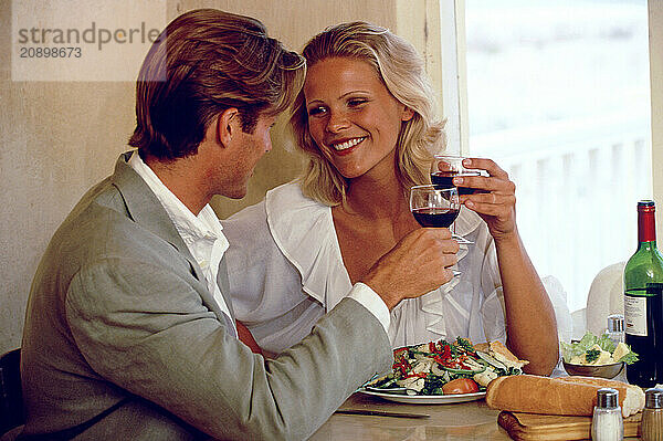 Indoor close up of young couple dining.