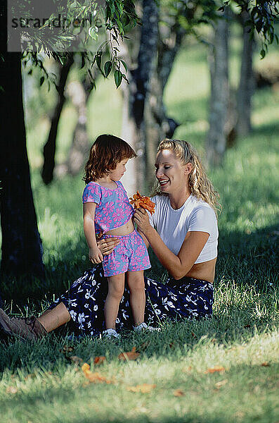 Family. Mother & little daughter outdoors in the park.