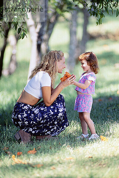 Family. Mother & little daughter outdoors in the park.