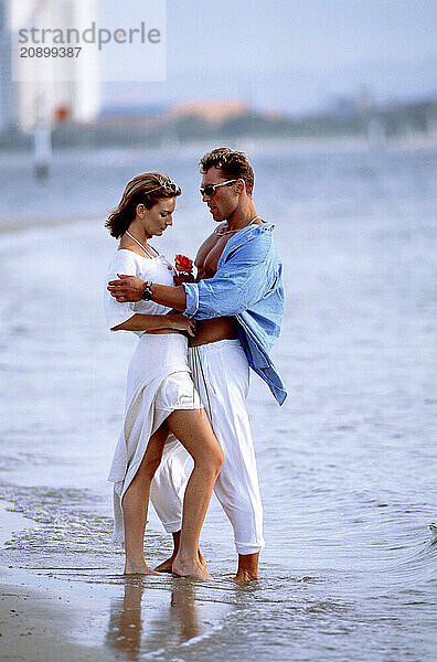 Australia. Queensland. Gold Coast. Young couple on the beach.