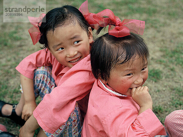 China. Shanghai. Local children. Little girls outdoors.