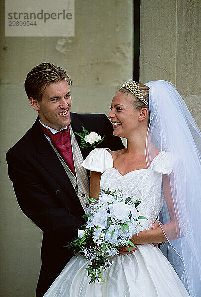 Lifestyle. Wedding couple. Bride and groom outside.