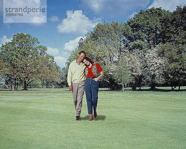 Young couple walking in the park.