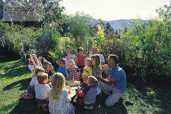 Family. Children's party on the garden lawn.