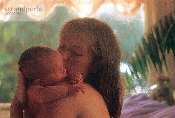 Mother & baby. Portrait indoors.