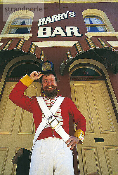 Australia. Sydney. The Rocks Area. Man in historic military uniform outside Harry's Bar.