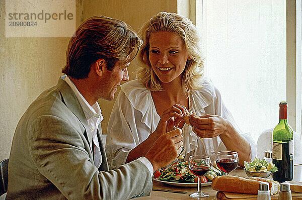 Indoor close up of young couple dining.