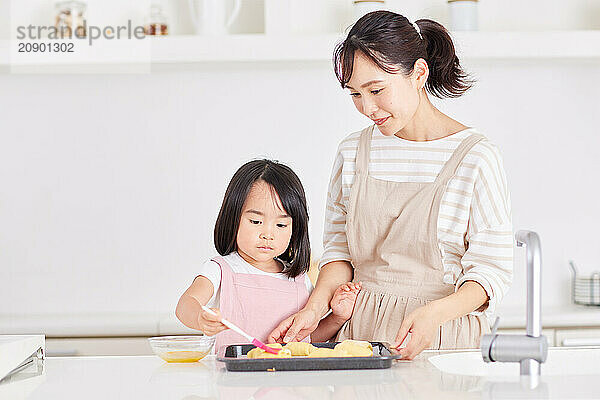 Japanese mother and daughter cooking in the kitchen