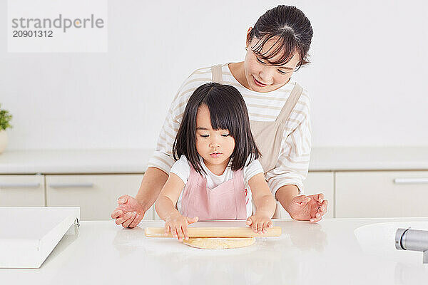 Japanese mother and daughter cooking in the kitchen