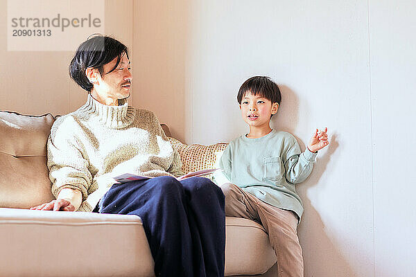 Japanese father and son on the sofa