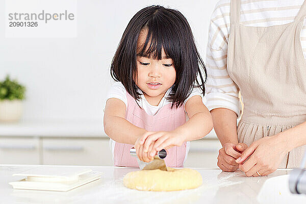 Japanese mother and daughter cooking in the kitchen