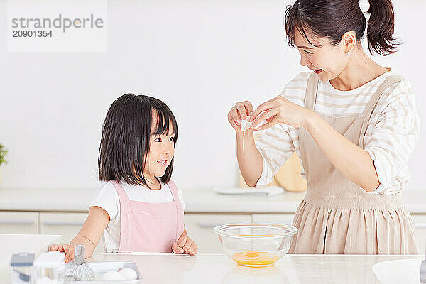 Japanese mother and daughter cooking in the kitchen