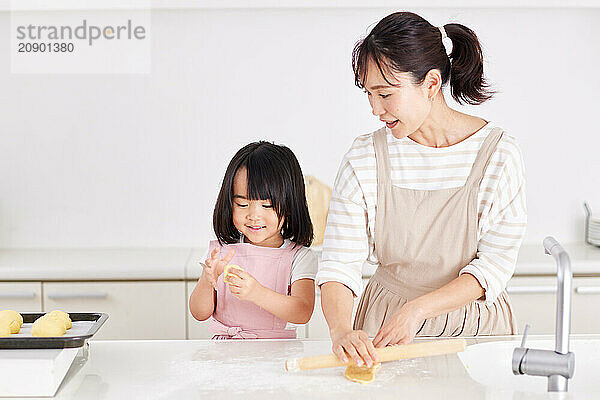 Japanese mother and daughter cooking in the kitchen