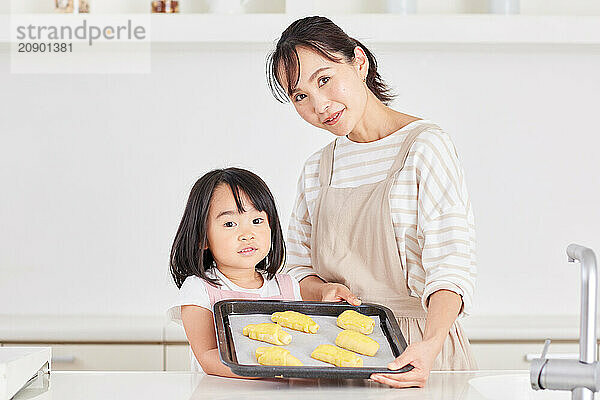 Japanese mother and daughter cooking in the kitchen