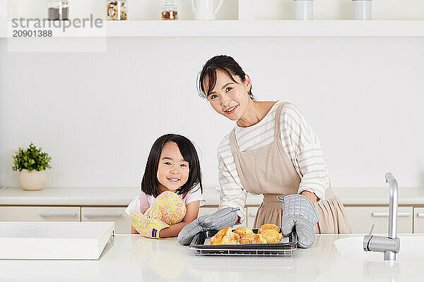 Japanese mother and daughter cooking in the kitchen