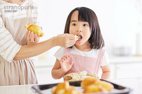 Japanese mother and daughter cooking in the kitchen