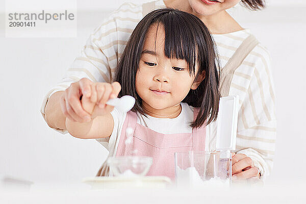 Japanese mother and daughter cooking in the kitchen