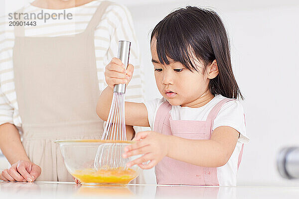 Japanese mother and daughter cooking in the kitchen