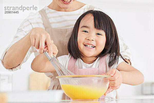 Japanese mother and daughter cooking in the kitchen