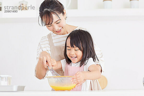 Japanese mother and daughter cooking in the kitchen