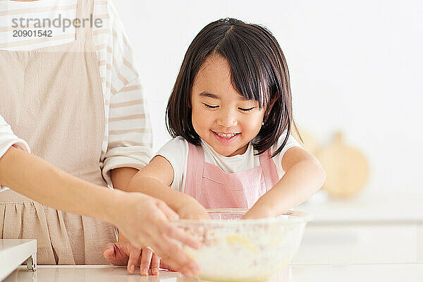 Japanese mother and daughter cooking in the kitchen