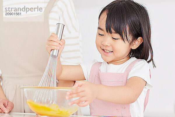 Japanese mother and daughter cooking in the kitchen