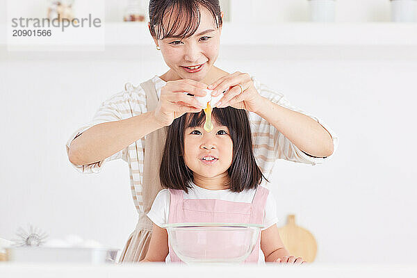 Japanese mother and daughter cooking in the kitchen