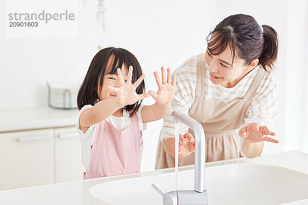 Japanese mother and daughter cooking in the kitchen