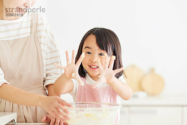 Japanese mother and daughter cooking in the kitchen