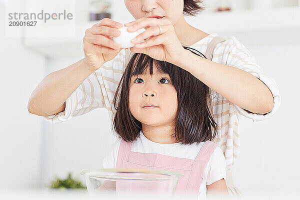 Japanese mother and daughter cooking in the kitchen