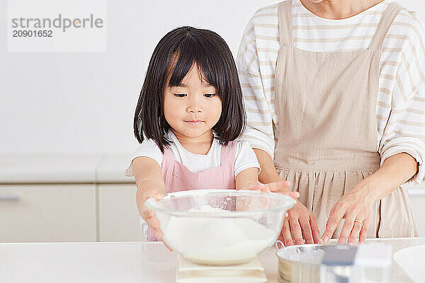 Japanese mother and daughter cooking in the kitchen