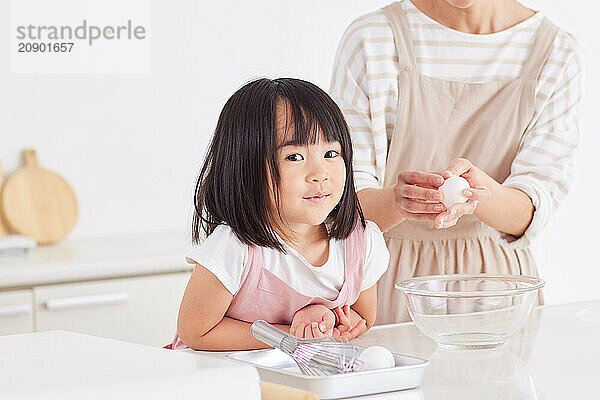 Japanese mother and daughter cooking in the kitchen