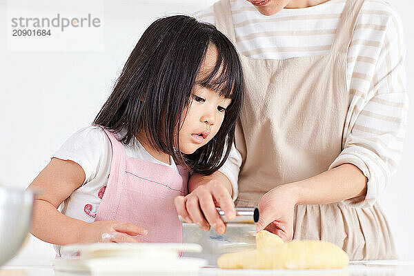 Japanese mother and daughter cooking in the kitchen