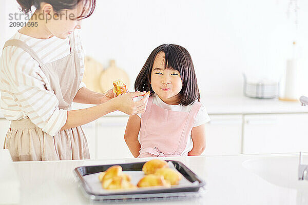 Japanese mother and daughter cooking in the kitchen