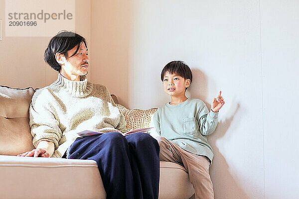 Japanese father and son on the sofa