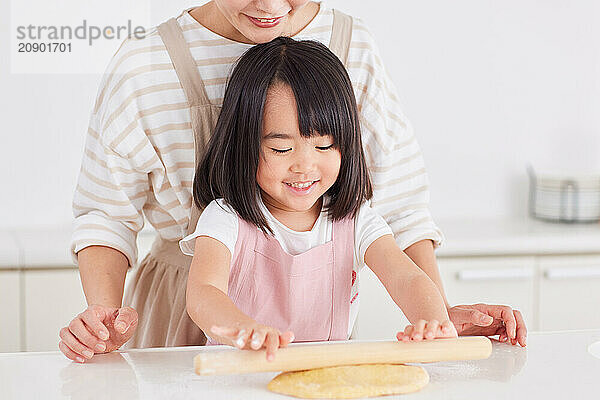 Japanese mother and daughter cooking in the kitchen