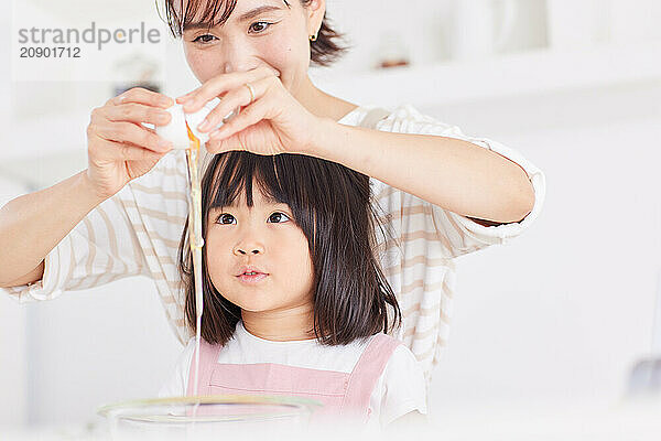 Japanese mother and daughter cooking in the kitchen