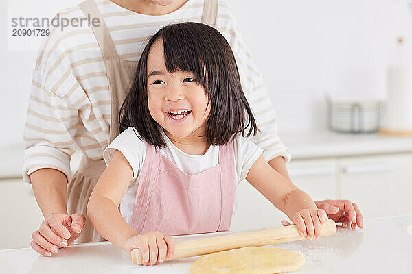 Japanese mother and daughter cooking in the kitchen