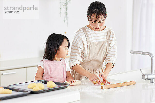 Japanese mother and daughter cooking in the kitchen