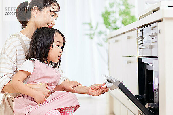 Japanese mother and daughter cooking in the kitchen