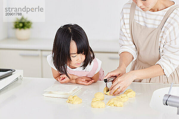 Japanese mother and daughter cooking in the kitchen