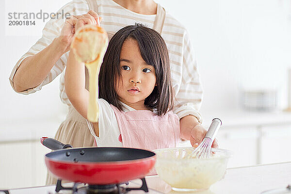 Japanese mother and daughter cooking in the kitchen